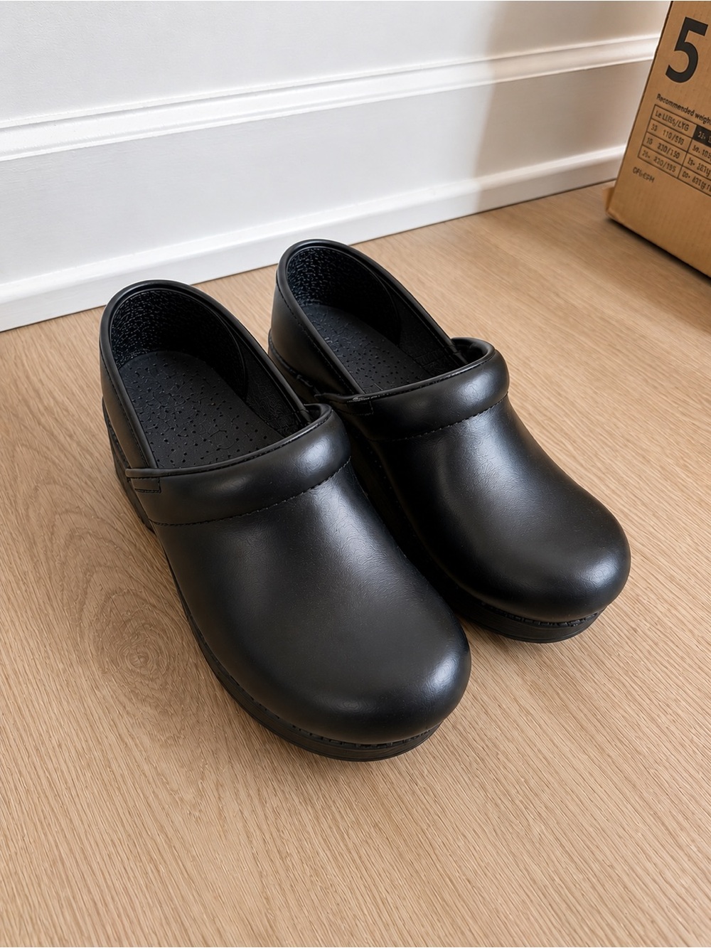 Dansko Women's Black Leather Clogs